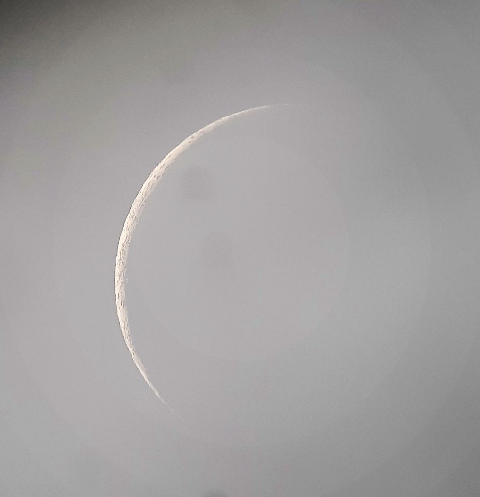 Thin crescent moon photo taken with a telescope